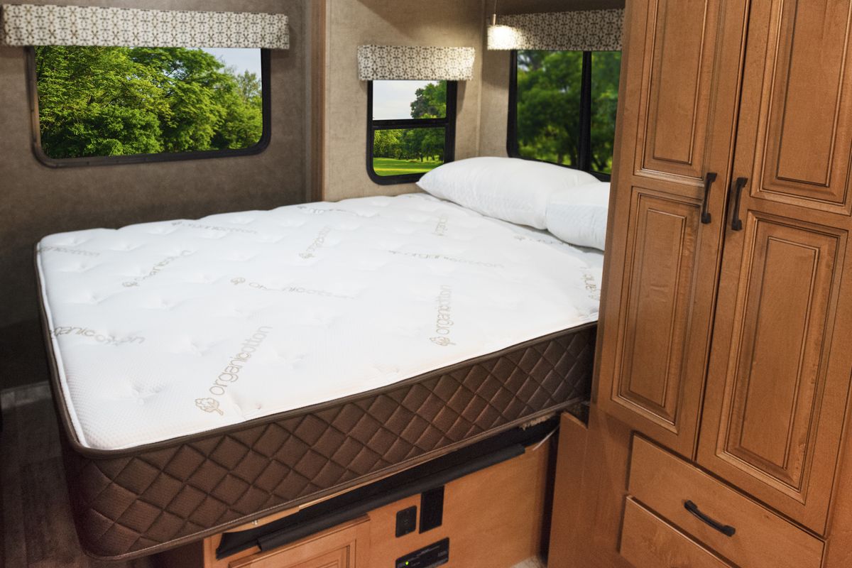 Queen mattress shown in an RV