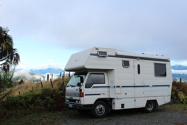 Small RV parked on a dirt road