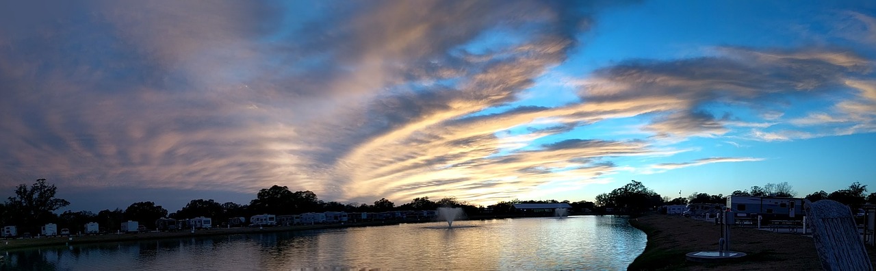 Beautiful sunset at a campground with parked RVs nearby